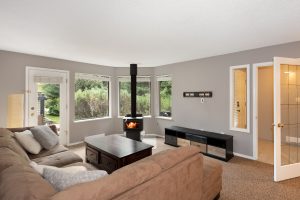 Bright living room with energy efficient wood stove