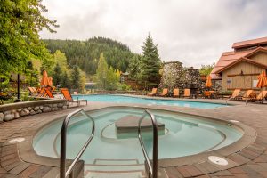 Year-round pool and hot tub overlooking the slopes